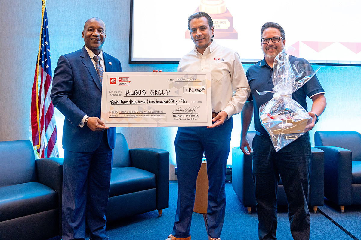 Nat Ford presenting a check to members from the HuGus Group