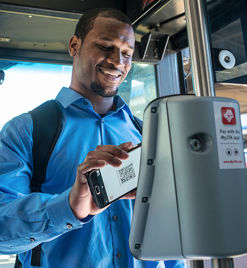 Best Fare Man Scanning Phone On Bus