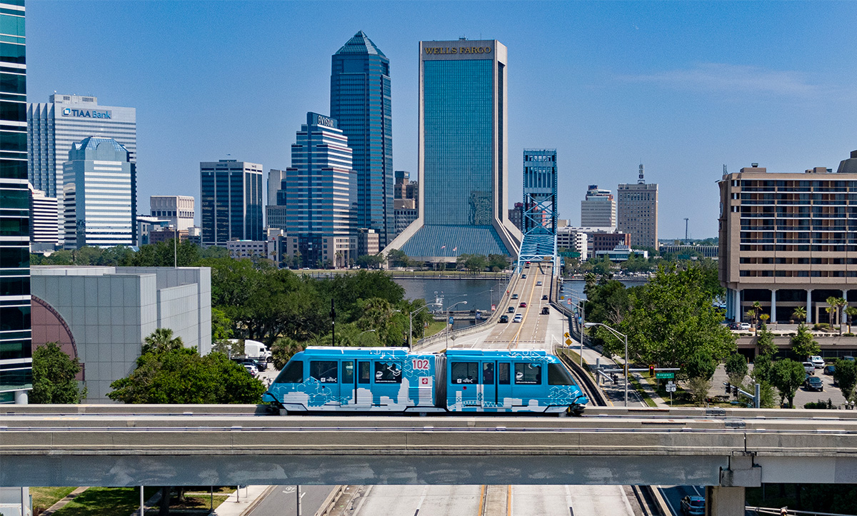 Skyway vehicle in front of the Jacksonville skyline